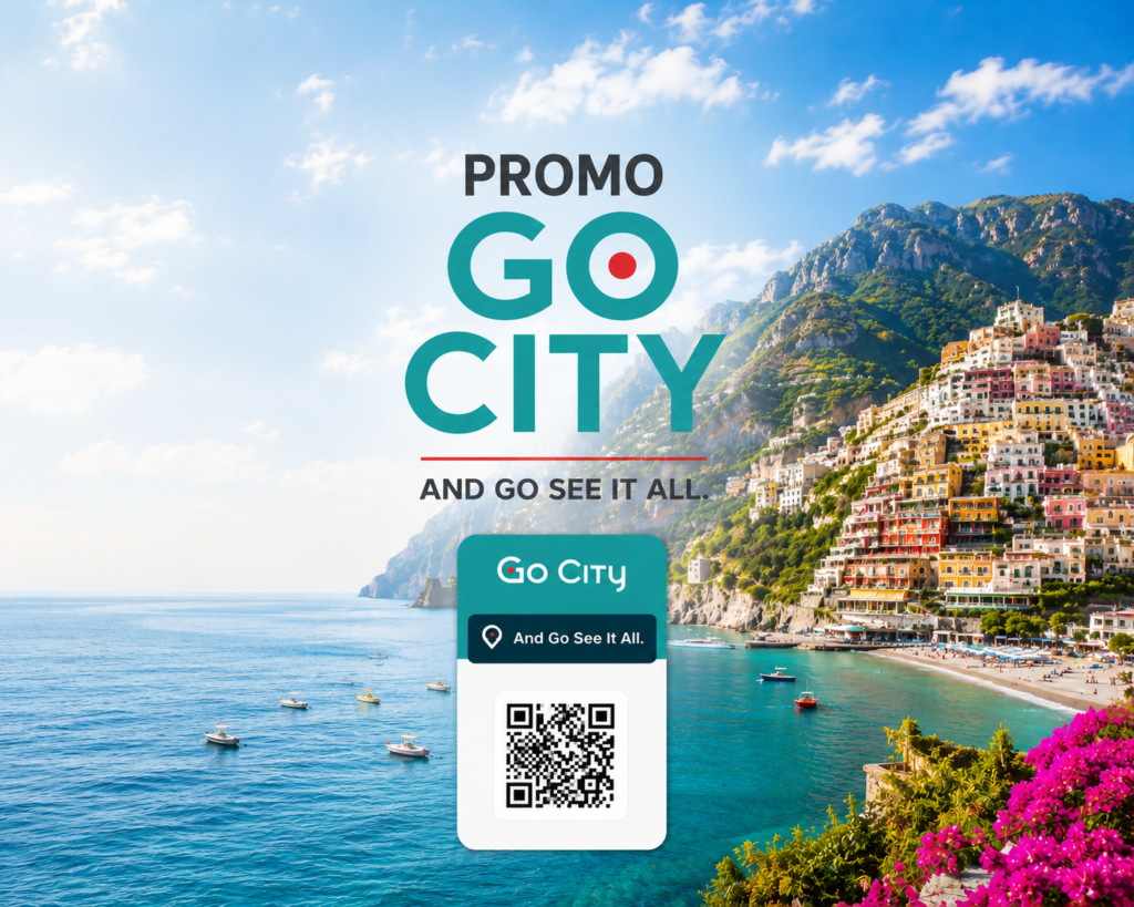 A digital Go City promo pass with a QR code floats over a scenic view of the colorful coastal town of Positano on the Amalfi Coast with boats on the sea.