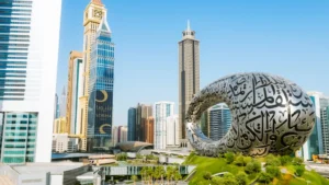 The iconic, ring-shaped Museum of the Future in Dubai, featuring intricate Arabic calligraphy, surrounded by modern skyscrapers and greenery.