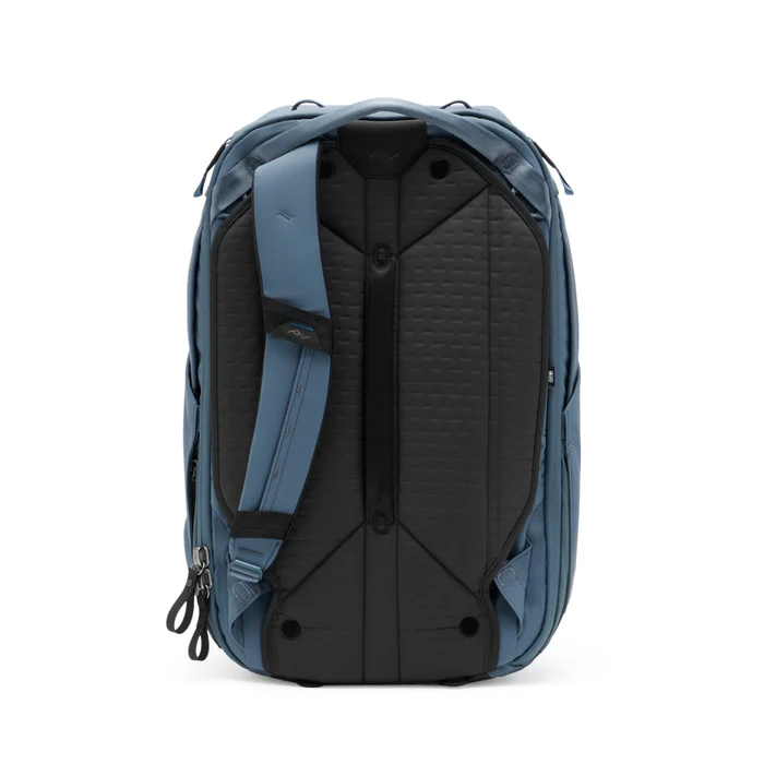 A minimalist blue travel backpack with black base detailing, designed for organization and outdoor adventure, shown against a white background.