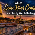 Evening Seine River cruise boat in Paris with illuminated Eiffel Tower in the background