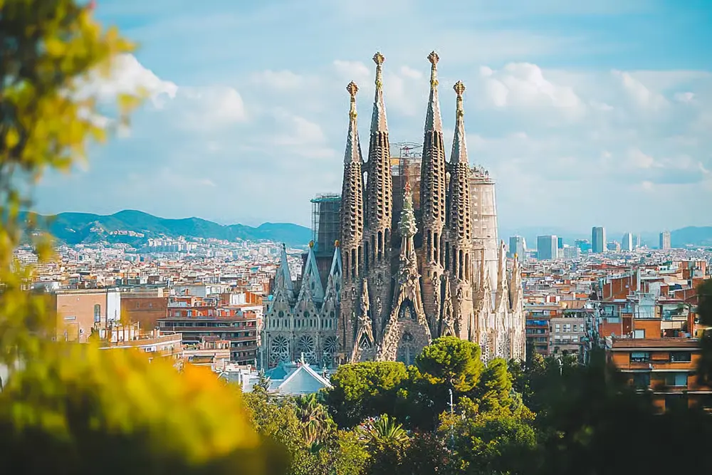 Panoramic view of the iconic Sagrada Familia basilica rising above the cityscape of Barcelona, Spain